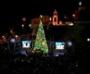 As darkness fell in Bethlehem on Saturday, a giant Christmas tree was lit up along with hundreds of bright, sparkling decorations.nnHundreds of people crowded into Manger Square to attend the annual lighting of the tree in the biblical West Bank city, heralding the Christmas holiday season.nnCapped with a Palestinian flag, the tree is traditionally erected in front of the Nativity Church, the birthplace of Jesus according to Christian tradition.nnChristmas Eve is a major event for Bethlehem and