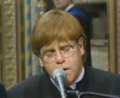 Performance by Elton John, of a special version of
