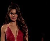 Jacqueline Fernandez SIZZLES IN RED as she sets the ramp ablaze in a cocktail evening gown. The Sri Lankan beauty looked head-to-toe sensuous in an embellished red gown with a deep plunging neckline. She accessorized the look with a matching long tassel bag. The sparkling gown is a safe bet for a red carpet event or a cocktail night. In 2018, the Bollywood actress turned showstopper for designers Monica and Karishma during the 10th anniversary of Jade in Mumbai. The duo-designer, to celebrate th