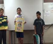 Students present their posters about themse that show up in survival stories.