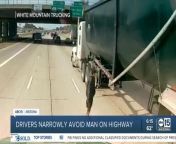 A trucker’s dash camera video shows the stunning moments of a person playing human frogger. The video shows a person dodging oncoming traffic and stopping right in between two semi trucks.
