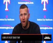 Texas Rangers third baseman Todd Frazier reviews the playing surface at Globe Life Field.