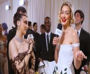 Gigi Hadid talks with Emma Chamberlain at the 2024 Met Gala about what she loves about the Met Gala and her stunning beaded Thom Browne dress.