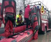 Italian firefighters used helicopters and rubber dinghies for a third day to evacuate stranded residents of a town in the northern region of Emilia Romagna that flooded when waters overran earthen dikes.