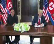 The US president Donald Trump and leader of North Korea Kim Jong-un sign a document together after their bilateral meeting in Singapore.