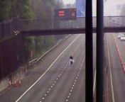 A man has been spotted doing his ironing on the closed side of the M1 motorway