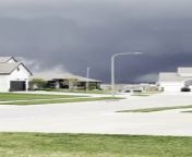 A large and powerful tornado formed over Bennington, Nebraska. The sheer size of the twister made it look like it was heading toward the homes but luckily, it drifted in a northerly direction and away from the homes.